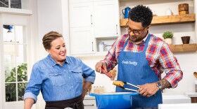 Test cook Lawman Johnson (right) makes host Julia Collin Davison the ultimate Pickle-Brined Fried Chicken Sandwich.