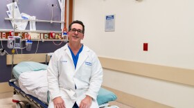 Dr. Clay Whiting sits on an emergency room bed on Jan. 27, 2025 at Scripps Mercy Hospital in San Diego, Calif. Whiting is an emergency physician and has been attacked by patients multiple times.
