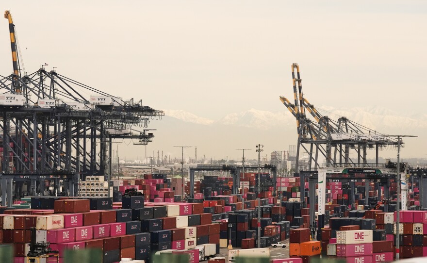 Containers are stacked at the Port of Los Angeles on Friday.