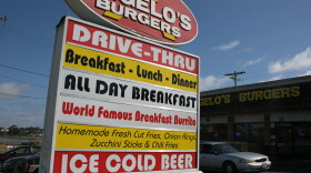 A sign for Angelo’s Burgers, which has three drive-thru eateries in Oceanside, promotes the restaurant, May 20, 2015.