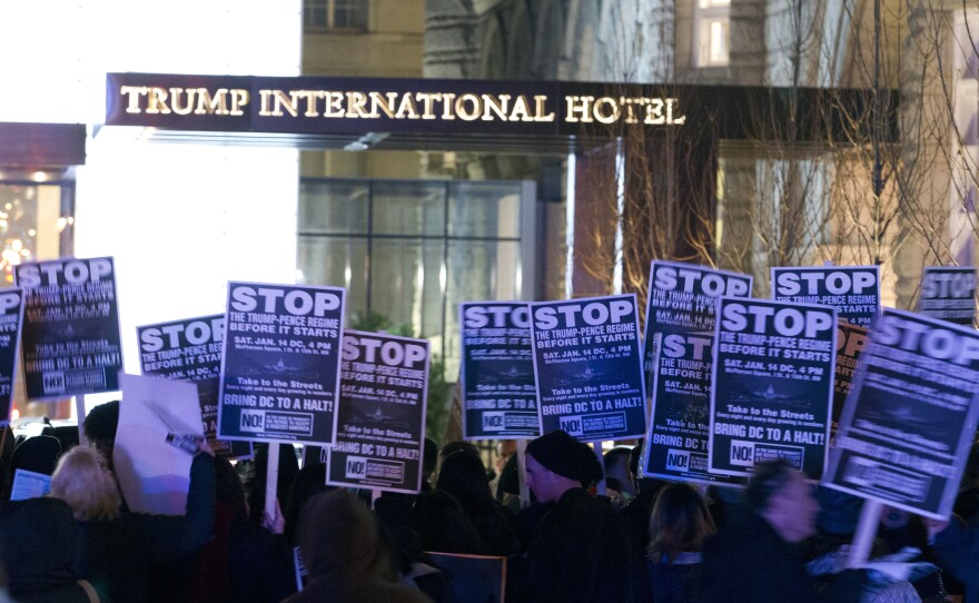 Demonstrators protest outside the Trump International Hotel in Washington, D.C., on Jan. 15.