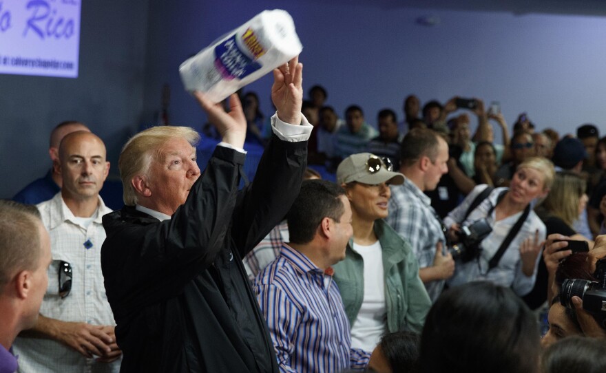 President Trump tosses paper towels into a crowd in Puerto Rico after Hurricane Maria hit the island in 2017.