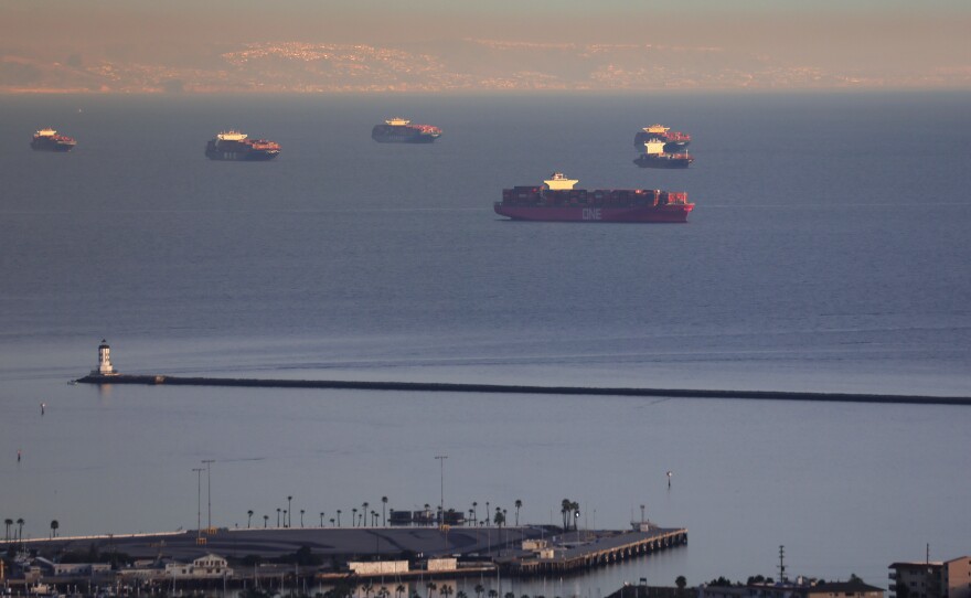 Container ships and tankers are anchored close to the ports of Los Angeles and Long Beach in February. The Port of Los Angeles logged its busiest month in history in May.