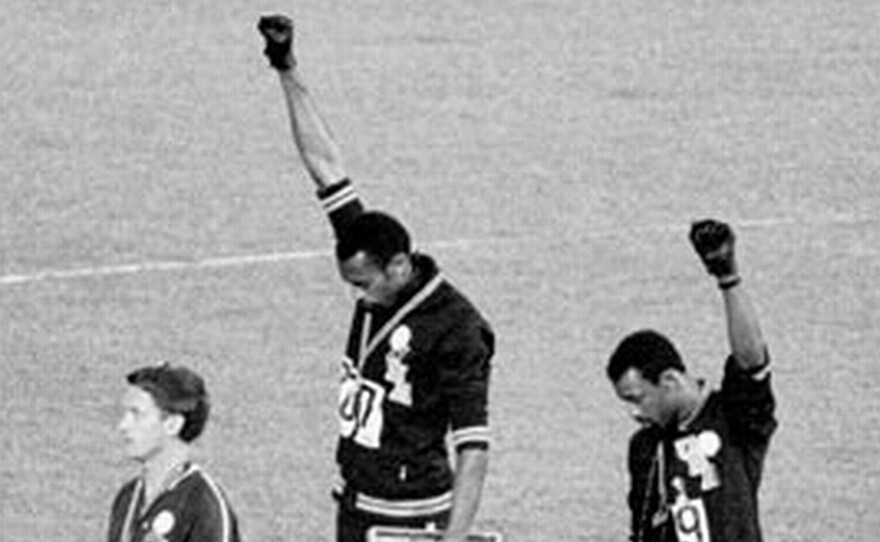 Tommie Smith (center) and John Carlos performed a Black Power salute at the 1968 Summer Olympics in Mexico City.