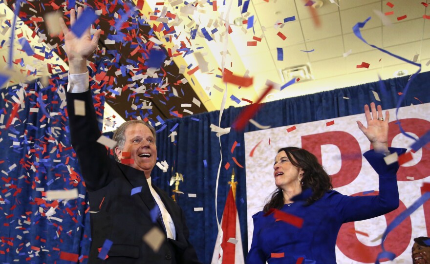 Democratic candidate for Senate Doug Jones and his wife, Louise, wave to supporters before he gave his victory speech in Birmingham, Ala., on Tuesday.
