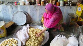 Ayesha Mumtaz inspects food during a raid on a backyard sweets factory in Lahore, Pakistan. Her campaign to clean up the kitchens and food factories of Pakistan has earned her the nickname "The Fearless One."