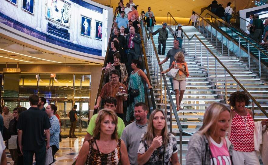 Patrons come down the escalator for the opening day of the Hard Rock Hotel and Casino in Atlantic City, N.J. on Thursday.