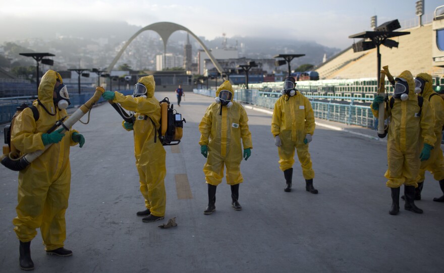 Health workers spray insecticide to combat Zika-carrying mosquitoes under the bleachers of the Sambódrome in Rio de Janeiro in January 2016.