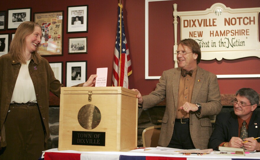 In Dixville Notch, N.H., in 2008, Tom Tillotson (center) watches as Donna Kaye Erwin casts the first ballot for the nation's first primary. That year, the tiny town picked Barack Obama over Hillary Clinton, 7-2; but Clinton went on to win the state primary.