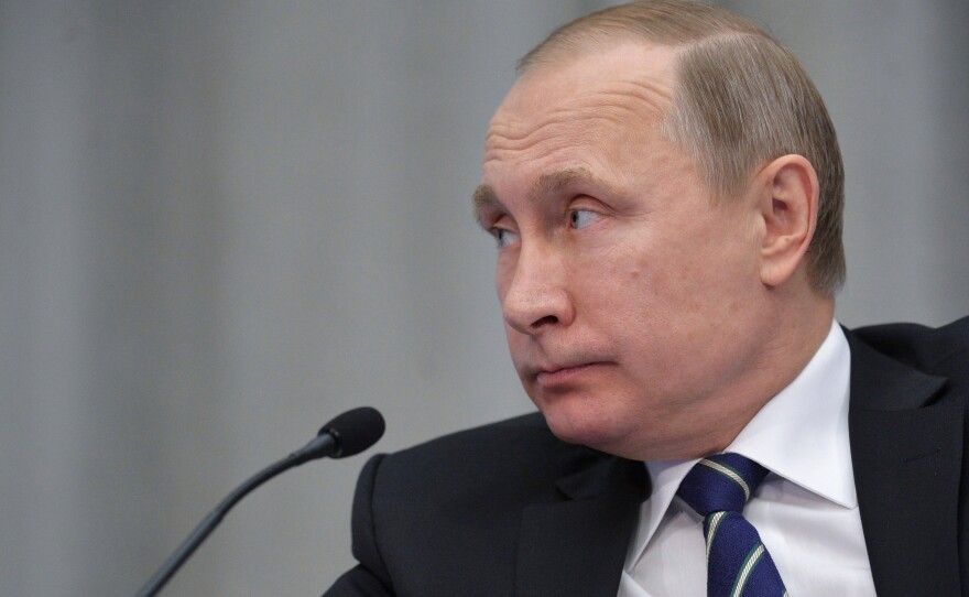 Russian President Vladimir Putin attends a meeting in Moscow on Wednesday. A British inquiry found Thursday that he was "probably" responsible for the plot that killed Livinenko in London in 2006.