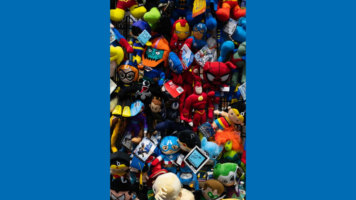 A collection of plushy figurines hang on a wall at San Diego Comic-Con, July 27, 2024. You can literally find anything pop-culture-related Comic-Con.