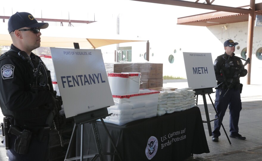 CBP agents, pictured Thursday, stand beside drugs seized last weekend at Arizona's Port of Nogales.