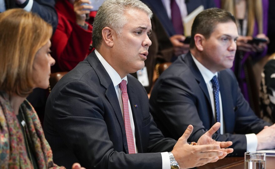 Colombian President Ivan Duque speaks during his meeting with President Biden in the Cabinet Room of the White House.