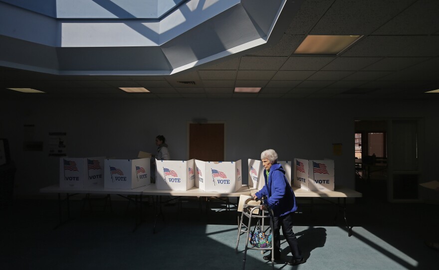 Primary voters cast their ballots Tuesday at Fairfax Circle Baptist Church in Fairfax, Va.