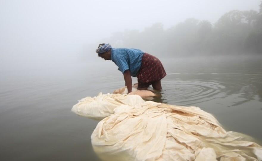 Each time a different natural dye is added to the fabric for a Good Earth pillow or quilt, it's rinsed, then laid to dry in the sun.