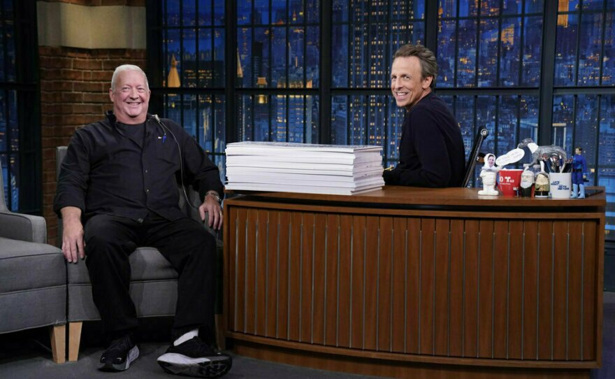 Cue card handler Wally Feresten with <em>Late Night</em> host Seth Meyers Monday.
