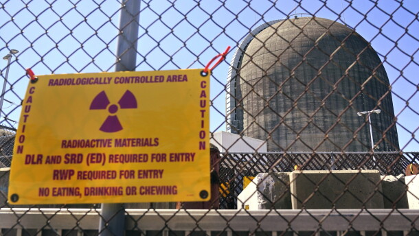 A sign warning of radioactive materials is seen on a fence outside Indian Point Energy Center in Buchanan, N.Y. just days before it closed in 2021. The Trump administration is seeking to overhaul nuclear safety rules to aid a nuclear revival.