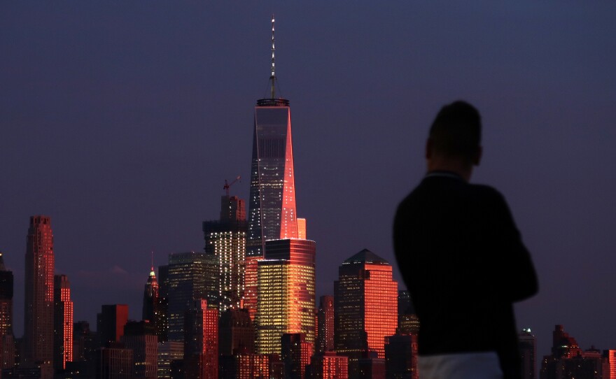 The sun sets on Lower Manhattan and One World Trade Center in New York City on Sept. 2 as seen from Hoboken, N.J.