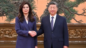 In this photo released by Xinhua News Agency, Chinese President Xi Jinping, right shakes hands with Kuomintang (KMT) party leader Cheng Li-wun in Beijing on Friday, April 10, 2026.