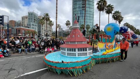 A float with a miniature of the Hotel Del Coronado and other San Diego landmarks in the Holiday Bowl Parade, Dec. 28, 2022.