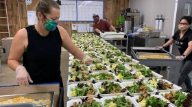 Volunteers preparing meals at the Green Oceanside Kitchen in this undated photo. 