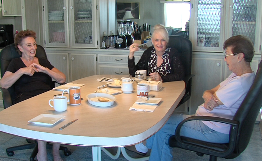 Linda Sills, left to right, Linda Walshaw and a friend gather around a table in Sills' Mission View West mobile home in Oceanside, March 3, 2017.