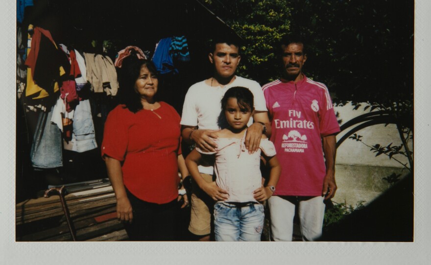 Ariel Ramos and his family pose for a portrait outside their home in Zabaleta, Colombia.