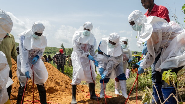 Red Cross workers bury an Ebola victim at the Rwampara Cemetery, in Rwampara, Congo, May 23, 2026.