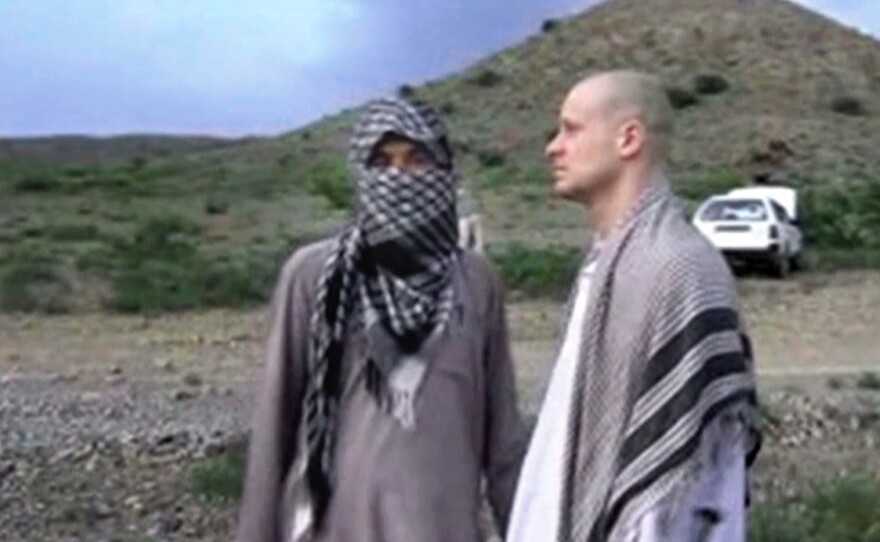 Sgt. Bowe Bergdahl (right) stands with a Taliban fighter in eastern Afghanistan, in this file image taken from video obtained from Voice Of Jihad Website. Bergdahl was held captive for five years before his release last year.