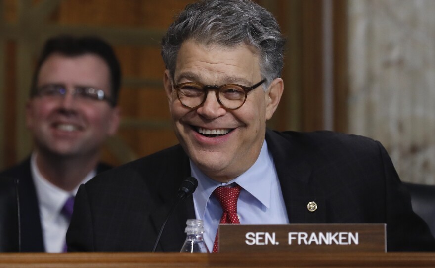 Sen. Al Franken, D-Minn., laughs as he jokes with Energy Secretary-designate and former Texas Gov. Rick Perry during Perry's confirmation hearing to become energy secretary.