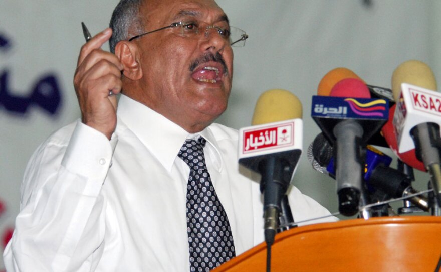 Yemeni President Ali Abdullah Saleh gives a speech at Sanaa University on Tuesday as vast numbers of protesters poured into a nearby square for a massive anti-regime rally.