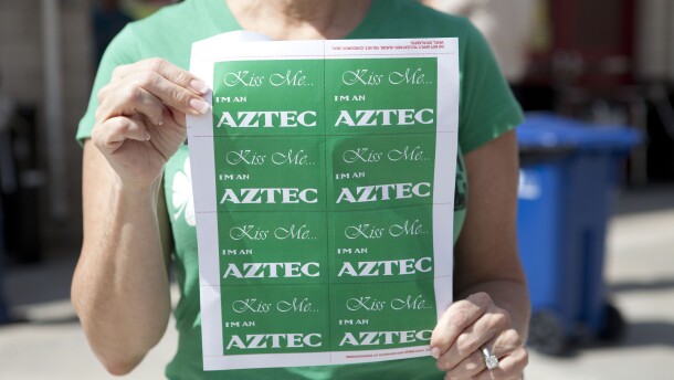 This woman handed out stickers celebrating both the Aztecs and St. Patrick's Day. 