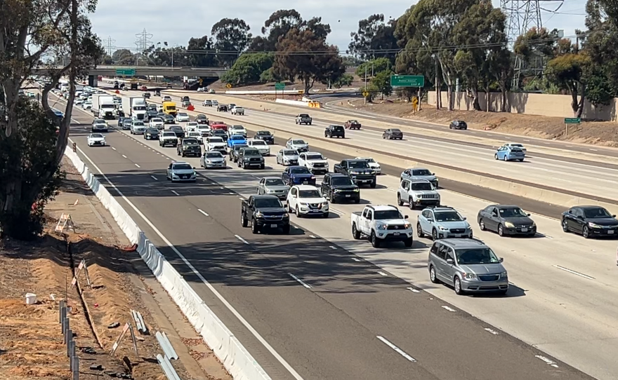 Cars drive in traffic in the southbound lanes of I-805 on July 22, 2025.