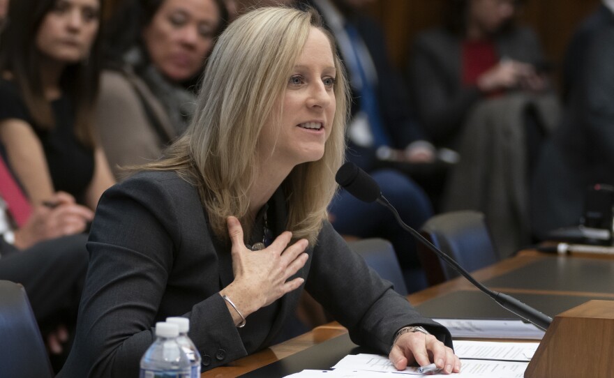 Kathleen Kraninger, director of the Consumer Financial Protection Bureau, testifies before the House Financial Services Committee on March 7. On Thursday, she faced questions from senators about problems with a student loan program for public service workers.