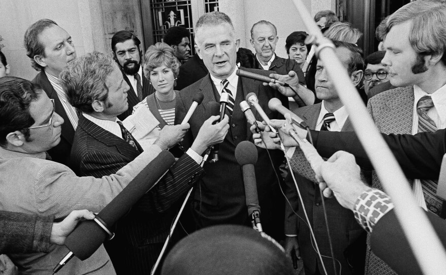 Special Watergate prosecutor Archibald Cox talks to media outside the U.S. District Court in Washington in 1973 after ousted White House counsel John W. Dean III pleaded guilty to conspiring to obstruct the Watergate investigation. President Nixon fired Cox the day after this press conference.