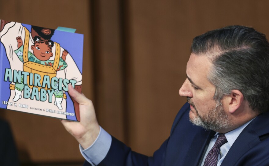 Sen. Ted Cruz holds up a book on antiracism as he questions U.S. Supreme Court nominee Judge Ketanji Brown Jackson.