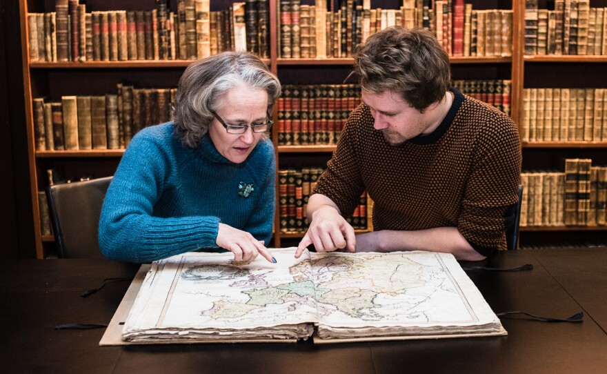 Reference librarian Anders Kvernberg (right) discovered the Cedid in the library's vaults. Research librarian and map historian Benedicte Gamborg Briså (left) confirmed its authenticity.