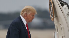 President Donald Trump boards Air Force One during his departure from Andrews Air Force Base, Md., Monday, Aug. 14, 2017. 