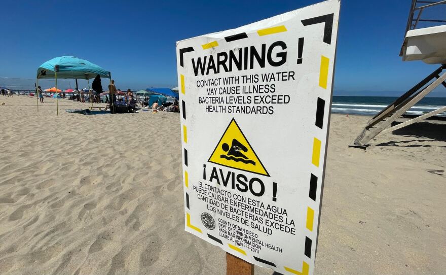A sign warning of high bacteria levels in the ocean water is seen at Imperial Beach, Calif. July 4, 2022.