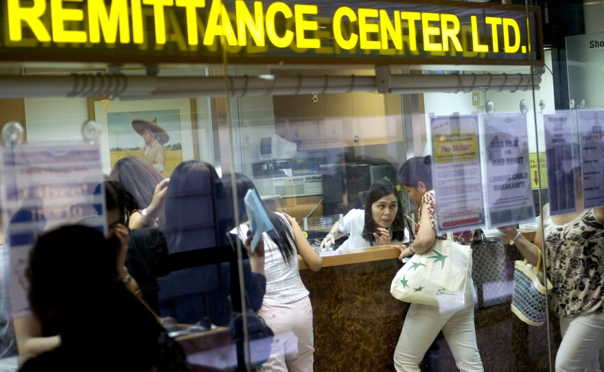 Remittances are a worldwide business. Above, an agent in Hong Kong specializes in transferring cash to the Philippines.