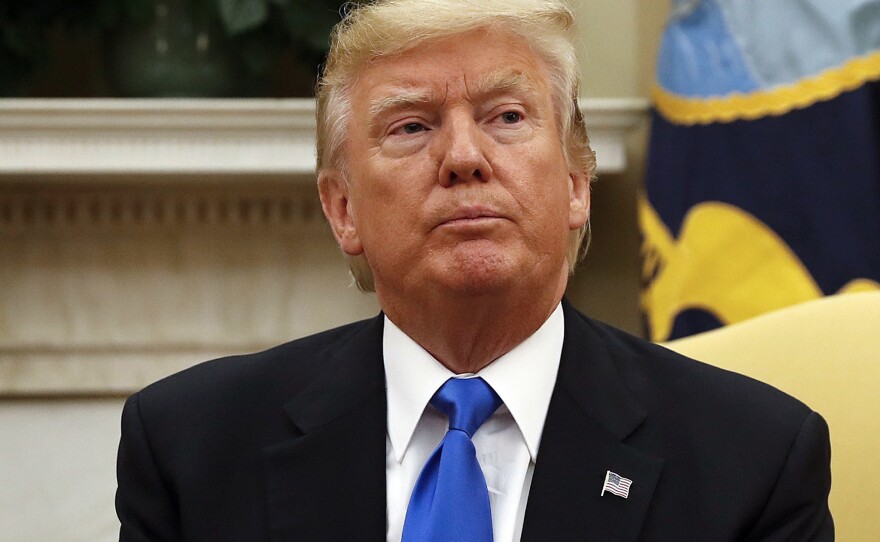 President Trump sits in the Oval Office of the White House in Washington on Tuesday.