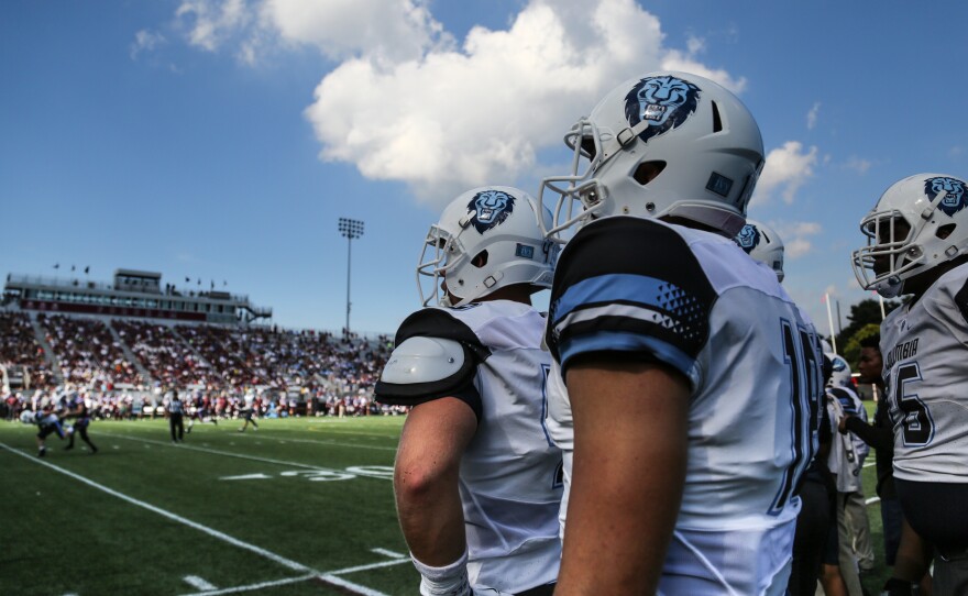 Columbia University players watch hopefully as they take on Fordham University. Despite a good start, the game ended in a loss for the Lions.