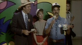 Ken Kramer and Tom Karlo appear on a KPBS TV auction.