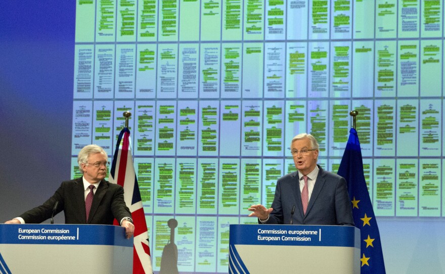 European Union chief Brexit negotiator Michel Barnier (right) and British Secretary of State for Exiting the European Union David Davis announced their progress Monday at EU headquarters in Brussels on Monday.