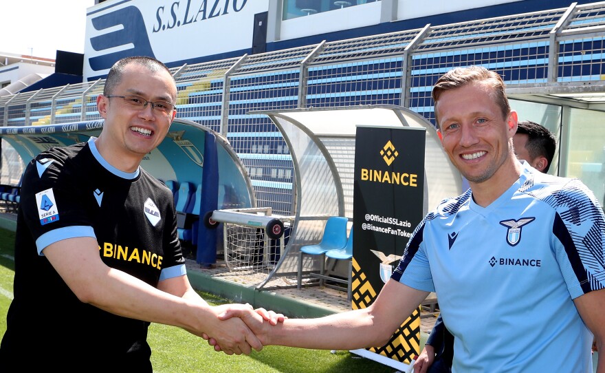 CZ shakes the hands with SS Lazio player Lucas Leiva during a visit to the Formello Sport centre in Rome, Italy, on May 12, 2022.