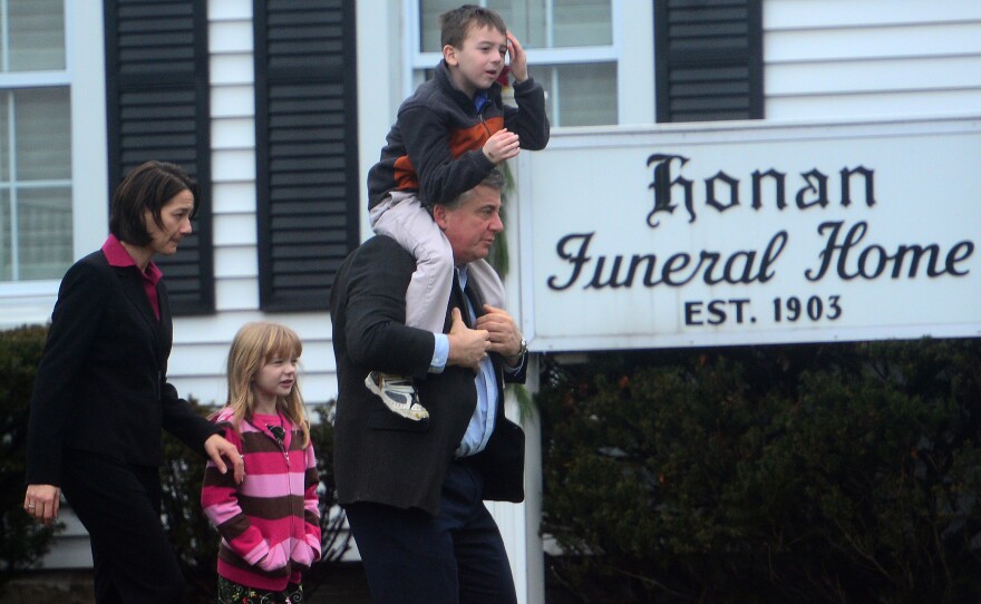 Mourners leave from Honan funeral home after attending the funeral for Jack Pinto, 6, one of the victims of the Sandy Hook elementary school shooting, in Newtown, Conn.