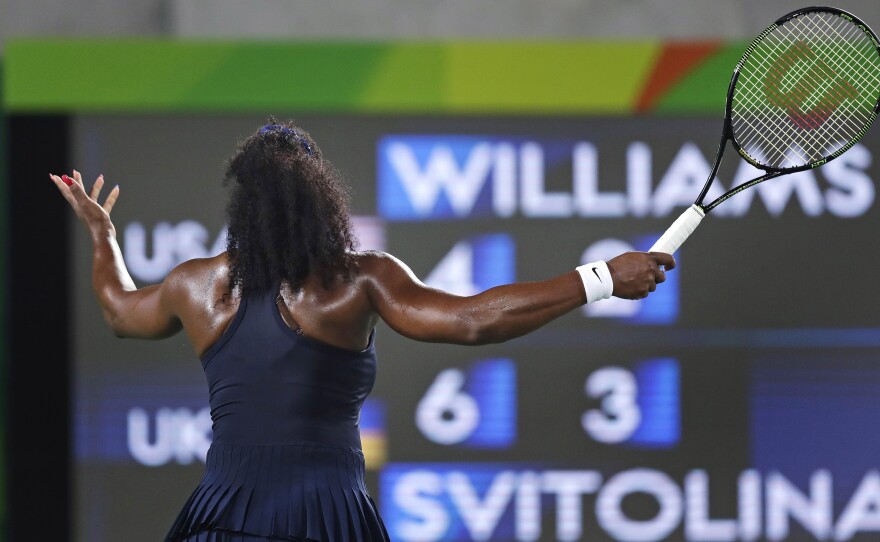 Serena Williams of the United States throws up her arms as she faces the scoreboard while trailing Elina Svitolina of Ukraine in the second set. Williams, the top seed, lost 6-4, 6-3.