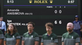 The scoreboard shows the results of the women's singles final match between Iga Swiatek of Poland and Amanda Anisimova of the U.S. at the Wimbledon Tennis Championships in London, Saturday, July 12, 2025.