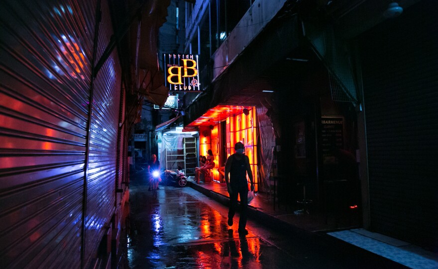The relatively empty Patpong red-light district in Bangkok. In March and April, Thailand closed its borders and canceled commercial flights because of the global pandemic. The country's tourism industry — which is entwined with the sex worker industry — collapsed.