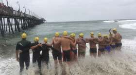 Athletes from six countries join arms before swimming off from Imperial Beach, Calif., to Mexico, in what they say is a show of solidarity with immigrants on Friday, May 5, 2017. 